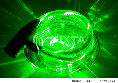 CD with lock on top and glowing green laser CD with lock on top and glowing green laser 77669834