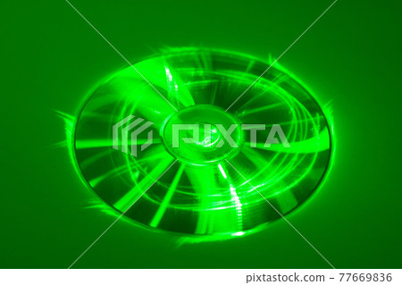 CD under green laser beam CD under green laser beam 77669836