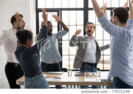 Happy excited millennial employees shouting for joy Happy excited millennial employees shouting for joy 77672246
