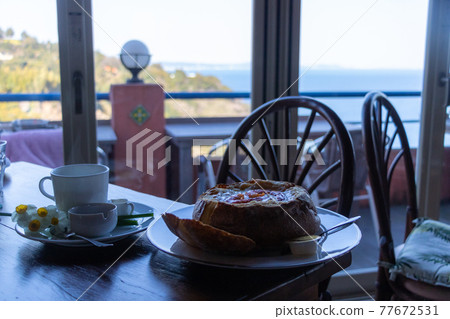 Scenic cafe on a cliff by the sea Scenic cafe on a cliff by the sea 77672531