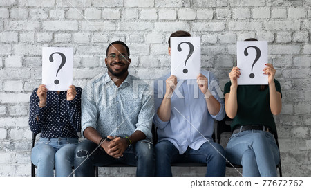 Happy job candidate celebrating successful interview, sitting near failed competitors Happy job candidate celebrating successful interview, sitting near failed competitors 77672762