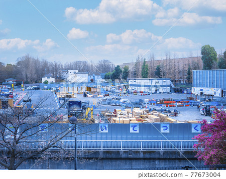 Material storage / construction office at a large-scale construction site 77673004