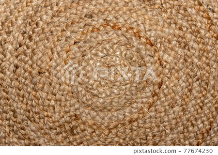 Beautiful circle pattern on handmade woven raffia basket Beautiful circle pattern on handmade woven raffia basket 77674230
