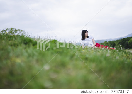 A woman in the park A woman in the park 77678337