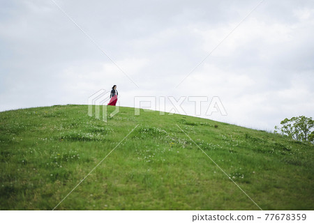 A woman in the park 77678359