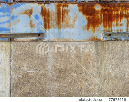Rust-stained iron plate and concrete wall 77678656