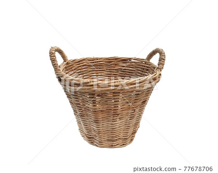 Basket with handles made of rattan. wicker basket isolated on white background with copy space. Basket with handles made of rattan. wicker basket isolated on white background with copy space. 77678706