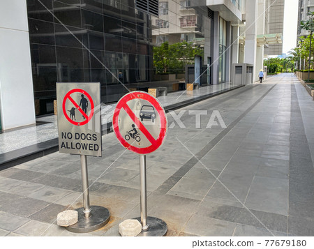 No dog allowed and parking restriction sign in common walking area No dog allowed and parking restriction sign in common walking area 77679180