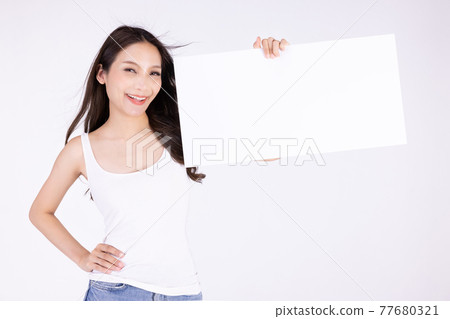 Asian cute woman show with white board isolated on gray background Asian cute woman show with white board isolated on gray background 77680321