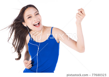 Portrait of young happy asian woman listening favorite music isolate on white background. Portrait of young happy asian woman listening favorite music isolate on white background. 77680323
