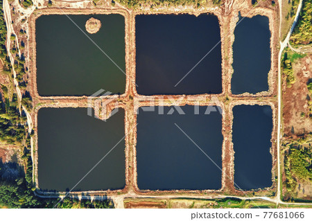 Stormwater ponds or rainwater artifical basins, aerial view 77681066