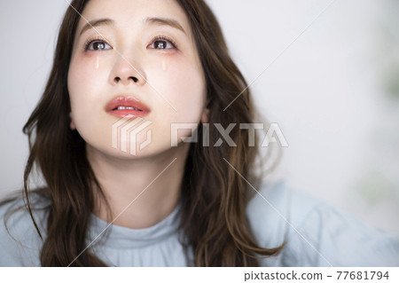 Crying woman tears 77681794