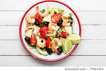 Summer salad with shrimps and strawberries,top view 77682854