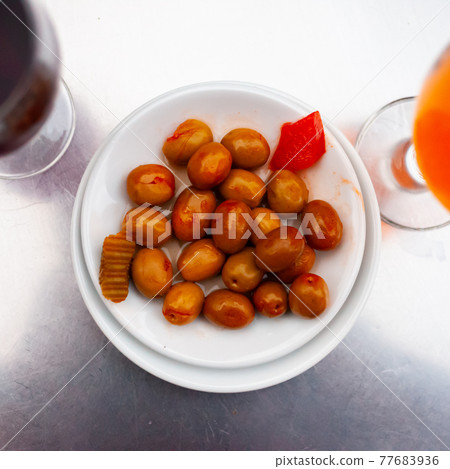 Unpitted brine cured green olives, Spanish tapas 77683936