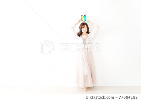 A young woman with a beginner's mark A young woman with a beginner's mark 77684182