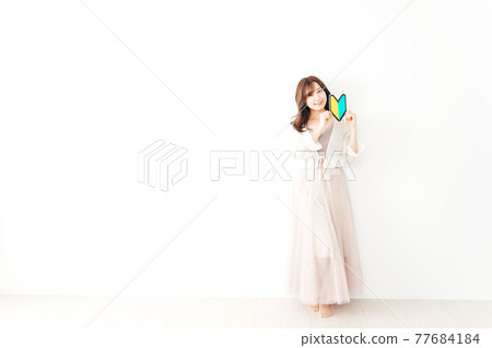 A young woman with a beginner's mark 77684184