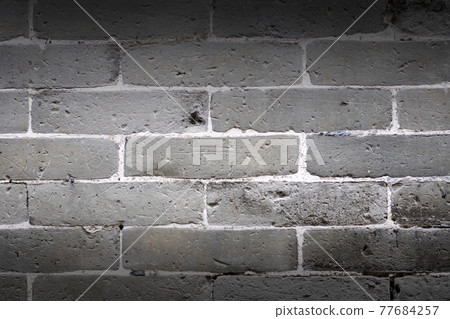Gray brick wall texture and background. 77684257