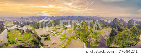 the majestic scenery on Ngo Dong river in Tam Coc Bich Dong view from drone in Ninh Binh province of Viet Nam the majestic scenery on Ngo Dong river in Tam Coc Bich Dong view from drone in Ninh Binh province of Viet Nam 77684271
