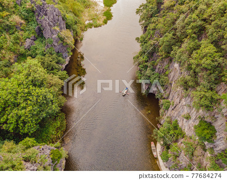 the majestic scenery on Ngo Dong river in Tam Coc Bich Dong view from drone in Ninh Binh province of Viet Nam the majestic scenery on Ngo Dong river in Tam Coc Bich Dong view from drone in Ninh Binh province of Viet Nam 77684274