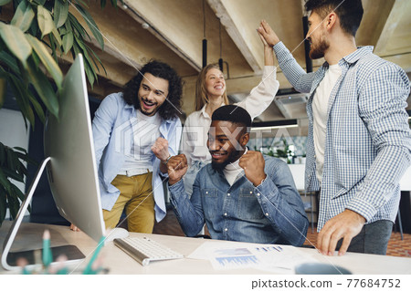 Happy overjoyed business team celebrate corporate victory Happy overjoyed business team celebrate corporate victory 77684752