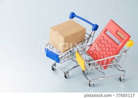 Shopping cart, calculator and cardboard box Image of shopping Shopping cart, calculator and cardboard box Image of shopping 77685117