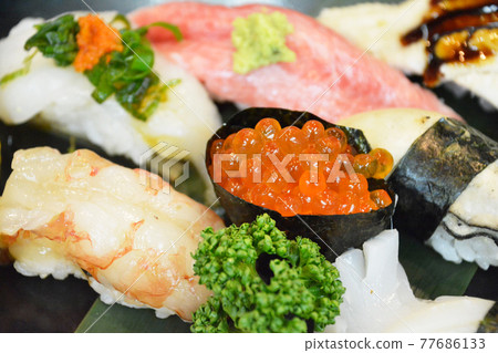 Assorted gorgeous nigiri sushi. Salmon roe gunkanmaki, shrimp, blowfish sashimi, fatty tuna, conger eel, oysters, parsley. Assorted gorgeous nigiri sushi. Salmon roe gunkanmaki, shrimp, blowfish sashimi, fatty tuna, conger eel, oysters, parsley. 77686133