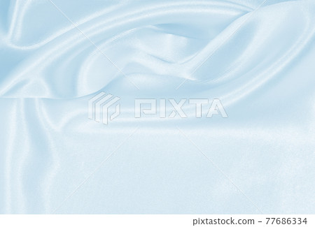 Smooth elegant blue silk or satin luxury cloth texture as abstract background. Luxurious background design 77686334