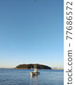 A landscape with a small boat on the beach 77686572