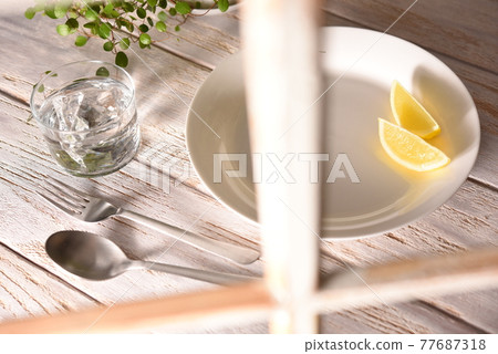 Table plate peeking through the window Table plate peeking through the window 77687318
