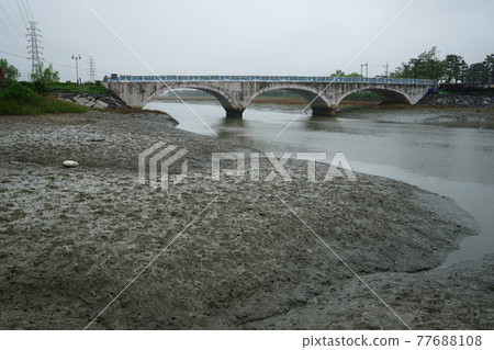 Windmill. Incheon Metropolitan City. Sorae Wetland Park. Tidal flat. Coastal area Windmill. Incheon Metropolitan City. Sorae Wetland Park. Tidal flat. Coastal area 77688108