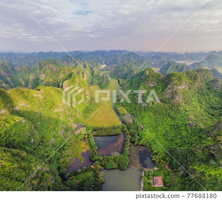 the majestic scenery on Ngo Dong river in Tam Coc Bich Dong view from drone in Ninh Binh province of Viet Nam 77688180