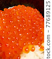Glossy and spilling salmon roe 77689125