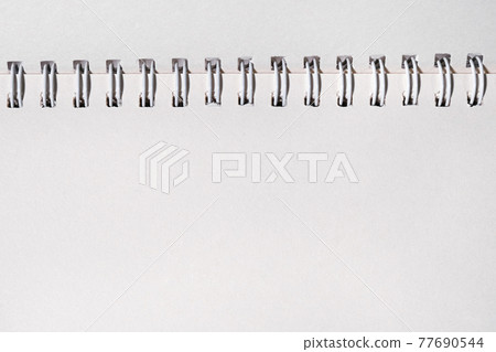 Schoo or office open notebook close up. Mock up of spiral notepad top view Schoo or office open notebook close up. Mock up of spiral notepad top view 77690544