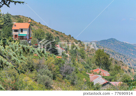 Brown roofs in the village of Kakopetria on a clear day in Cyprus Brown roofs in the village of Kakopetria on a clear day in Cyprus 77690914