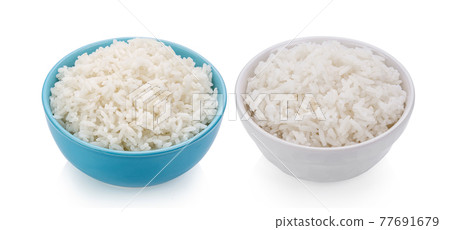 Rice in a bowl on white background 77691679