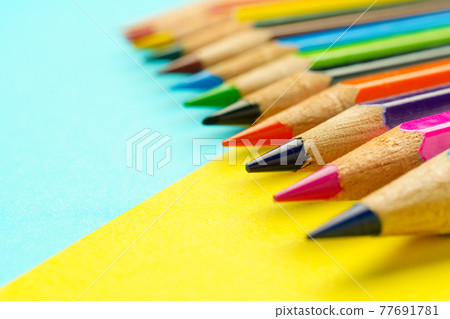 Colored pencils placed on construction paper Colored pencils placed on construction paper 77691781