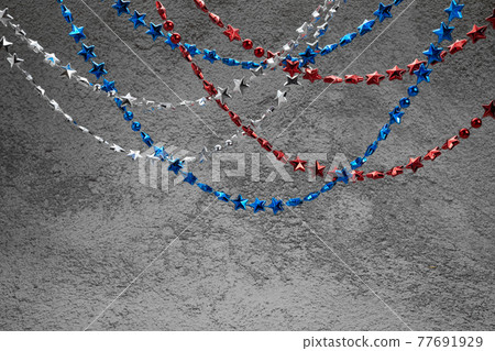 American Independence Day red blue white stars beads on on Dark Concrete Background. USA flag colors stylish fourth of july wallpaper. American Independence Day red blue white stars beads on on Dark Concrete Background. USA flag colors stylish fourth of july wallpaper. 77691929