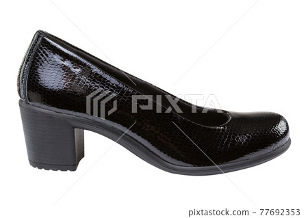 elegant lacquered female shoes made of reptile skin, with heels, on a white background elegant lacquered female shoes made of reptile skin, with heels, on a white background 77692353