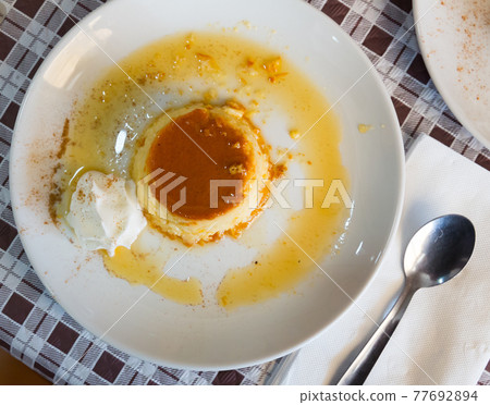 Typical catalan creme dessert flan con nata with caramel crust 77692894
