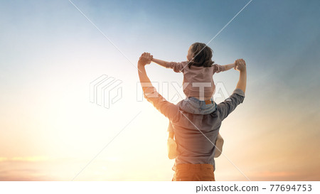 Father and his daughter outdoors 77694753