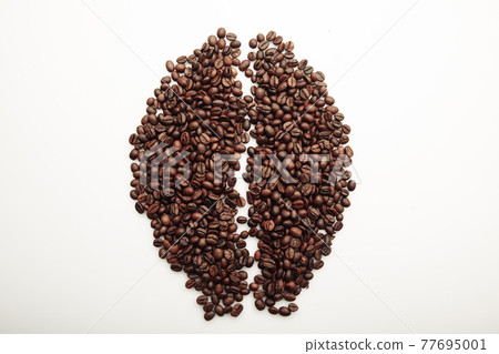 Roasted coffee beans laid out in the form of a large coffee grain 77695001