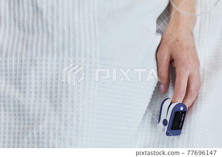 Patient measuring the pulse 77696147