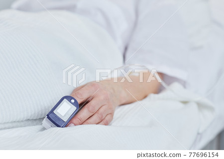 Patient lying in bed Patient lying in bed 77696154
