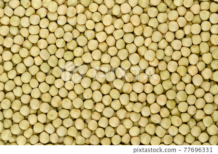 Dried whole peas, background, from above. Raw small spherical seeds of the pod fruit Pisum sativum with greenish and yellowish color, mostly used for soups. Backdrop. Close-up, macro food photo. Dried whole peas, background, from above. Raw small spherical seeds of the pod fruit Pisum sativum with greenish and yellowish color, mostly used for soups. Backdrop. Close-up, macro food photo. 77696331