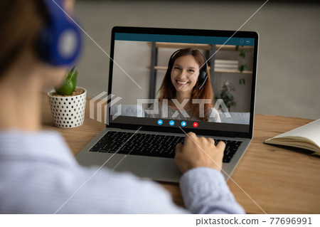Female recruiter in headset speaking with woman candidate by laptop 77696991