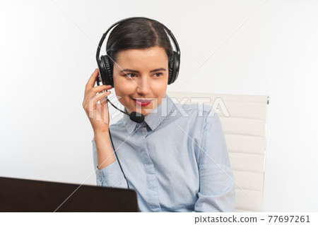 Pretty smiling business woman with headset 77697261