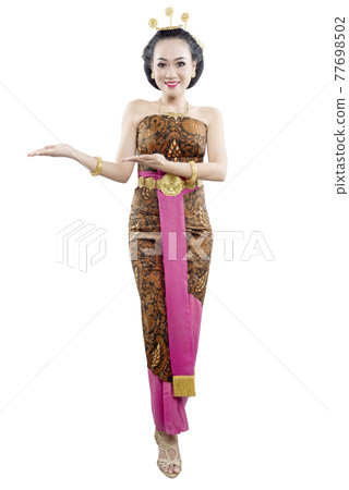 Asian woman with Java traditional dance costume showing something Asian woman with Java traditional dance costume showing something 77698502