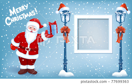 Santa Claus with gift box and photo frame on background of Christmas snowfall, street lamp and inscription "Merry Christmas" Santa Claus with gift box and photo frame on background of Christmas snowfall, street lamp and inscription "Merry Christmas" 77699363