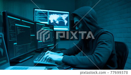 Asian male hacker use laptop 77699378