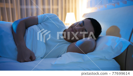 asian man sleep well 77699614